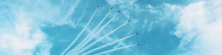 Jet planes flying up into the sky in formation, banner at the top of InnoScale's Home page