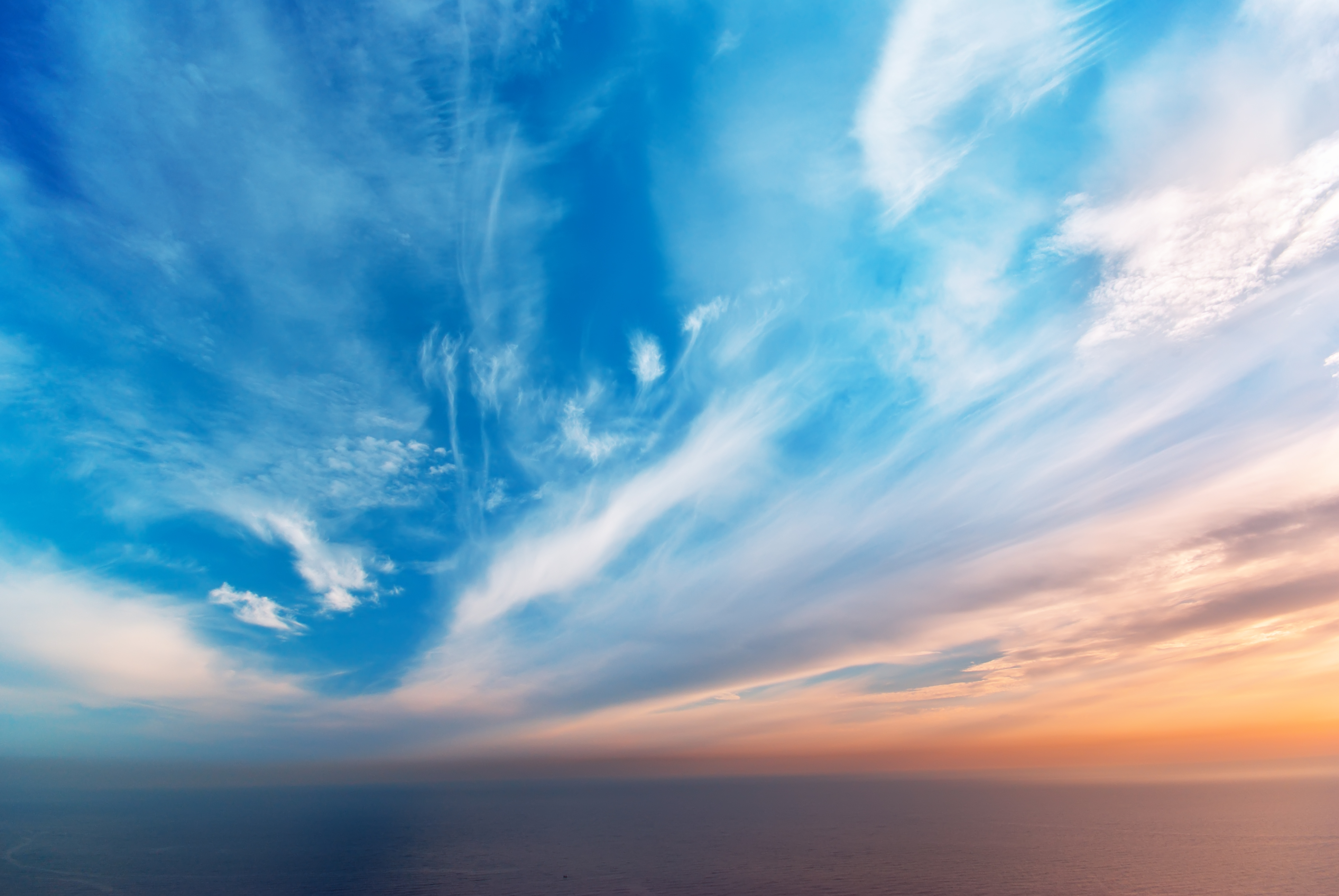 Blue sky with light clouds and sunset